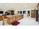 Open kitchen includes a granite island, built-in cabinets, and access to a bar area at 2770 La Casita Ave, Las Vegas, NV 89120