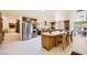 Large kitchen with stainless steel appliances, an island with seating, and classic wooden cabinets at 2770 La Casita Ave, Las Vegas, NV 89120