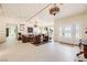 Bright living room with white tile floors, contemporary furnishings, and large windows with outdoor views at 2770 La Casita Ave, Las Vegas, NV 89120