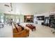 Comfortable living area featuring a stone fireplace, ample seating, and sliding glass doors to the patio at 2770 La Casita Ave, Las Vegas, NV 89120