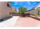 Spacious backyard featuring a brick patio and block wall for privacy at 309 Clifton Heights Dr, Las Vegas, NV 89145