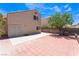 Spacious backyard featuring tile flooring, a tree, and block wall fencing at 309 Clifton Heights Dr, Las Vegas, NV 89145