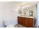 Bathroom with double sink vanity, granite countertop, and shower-tub combination and tiled floors at 309 Clifton Heights Dr, Las Vegas, NV 89145