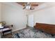 Bedroom with neutral walls, ceiling fan, a large window and accent rug at 309 Clifton Heights Dr, Las Vegas, NV 89145