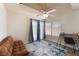 Bedroom with neutral walls, ceiling fan, a large window and accent rug at 309 Clifton Heights Dr, Las Vegas, NV 89145