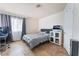 Bedroom featuring a bed, desk, tiled floors, and a window with curtains at 309 Clifton Heights Dr, Las Vegas, NV 89145