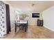 Comfortable dining room with plenty of natural light from the large window, with tile floors and neutral walls at 309 Clifton Heights Dr, Las Vegas, NV 89145