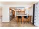 Open kitchen features wood cabinets, tile floors and backsplash, with a breakfast bar for casual dining at 309 Clifton Heights Dr, Las Vegas, NV 89145