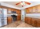 Efficient kitchen featuring stainless steel appliances, wood cabinetry, and a functional layout for easy meal preparation at 309 Clifton Heights Dr, Las Vegas, NV 89145