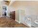 Upstairs hallway with tiled flooring and wood cabinetry at 309 Clifton Heights Dr, Las Vegas, NV 89145