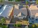 Aerial view of the backyard featuring a patio and block wall fence at 323 Harpers Ferry Ave, Las Vegas, NV 89148