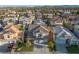 Aerial view of a residential home, showcasing the roof, landscaping, and surrounding neighborhood at 323 Harpers Ferry Ave, Las Vegas, NV 89148