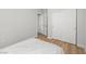 Bedroom featuring a closet, wood flooring, and natural light at 323 Harpers Ferry Ave, Las Vegas, NV 89148
