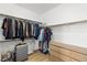 Spacious walk-in closet featuring wood shelving and clothing racks at 323 Harpers Ferry Ave, Las Vegas, NV 89148