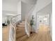 Elegant curved staircase highlighting the open floor plan and transition to the upper level at 323 Harpers Ferry Ave, Las Vegas, NV 89148