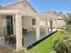 Inviting backyard includes a covered patio and artificial grass at 3329 Hidden Ridge St, Las Vegas, NV 89129
