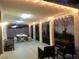 Covered patio with outdoor furniture and string lights, offering a cozy ambiance at 3329 Hidden Ridge St, Las Vegas, NV 89129