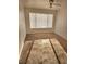 Bedroom with neutral carpet, ceiling fan, and window letting in light at 3425 E Russell Rd # 265, Las Vegas, NV 89120