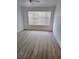 Bedroom features a modern ceiling fan, a window, and hardwood floors at 3425 E Russell Rd # 265, Las Vegas, NV 89120