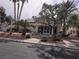 Exterior view of the clubhouse showcasing desert landscaping and covered entrance at 3425 E Russell Rd # 265, Las Vegas, NV 89120