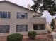 Two story home with a balcony, multiple windows, and low maintenance landscaping at 3425 E Russell Rd # 265, Las Vegas, NV 89120