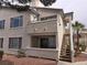 Exterior view of a condo unit with balcony and stairs to upper level at 3425 E Russell Rd # 265, Las Vegas, NV 89120