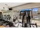 Community gym with modern fitness equipment overlooking the pool and patio at 3425 E Russell Rd # 265, Las Vegas, NV 89120