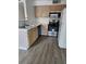 Bright kitchen featuring stainless steel appliances, light wood cabinetry, and a modern sink with new flooring at 3425 E Russell Rd # 265, Las Vegas, NV 89120