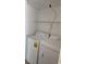 Convenient laundry area features a washer and dryer, plus shelving for storage and organization at 3425 E Russell Rd # 265, Las Vegas, NV 89120
