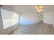Spacious living room with natural light and wood-look flooring at 3425 E Russell Rd # 265, Las Vegas, NV 89120