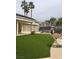 Community pool area with manicured artificial turf and outdoor amenities at 3425 E Russell Rd # 265, Las Vegas, NV 89120