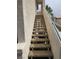 Exterior stairway with sturdy railings leading to upper-level units at 3425 E Russell Rd # 265, Las Vegas, NV 89120