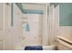 Clean bathroom with a bathtub and shower, complemented by white tiles and a fresh ambiance at 3624 Snowy Pines St, Las Vegas, NV 89147