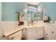 Bright bathroom with a clean vanity, a well-lit mirror, and white tiled walls at 3624 Snowy Pines St, Las Vegas, NV 89147