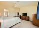Large bedroom featuring a comfortable bed, a dresser, and an adjoining bathroom at 3624 Snowy Pines St, Las Vegas, NV 89147