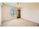 Bedroom with a window, carpet, and a wooden cabinet at 3624 Snowy Pines St, Las Vegas, NV 89147