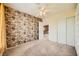 Bedroom with a decorative accent wall, and built-in shelving at 3624 Snowy Pines St, Las Vegas, NV 89147