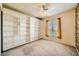 Bedroom with a large built-in bookshelf and a window with curtains at 3624 Snowy Pines St, Las Vegas, NV 89147
