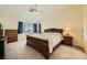 Inviting bedroom with a comfortable bed, dark wood furniture, and great natural light at 3624 Snowy Pines St, Las Vegas, NV 89147