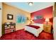 Cozy bedroom with warm lighting, a comfortable bed, and ample storage space at 3624 Snowy Pines St, Las Vegas, NV 89147