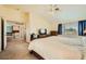 Spacious bedroom with vaulted ceilings, a large bed, and a view to the adjoining hallway at 3624 Snowy Pines St, Las Vegas, NV 89147