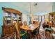 Spacious dining area showcasing a wooden table, chairs, and an exquisite china cabinet at 3624 Snowy Pines St, Las Vegas, NV 89147