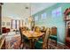 Comfortable dining area adjacent to the living space, featuring classic decor and ample natural light at 3624 Snowy Pines St, Las Vegas, NV 89147