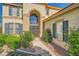 Charming home with large arched window and lush landscaping at 3624 Snowy Pines St, Las Vegas, NV 89147