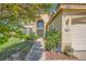 Beautiful home featuring an arched window, mature landscaping and covered porch at 3624 Snowy Pines St, Las Vegas, NV 89147