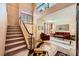 Welcoming foyer with a staircase leading to the upper level and a view of the living room at 3624 Snowy Pines St, Las Vegas, NV 89147
