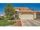 Well-maintained home with a two-car garage, manicured lawn, and desert landscaping at 3624 Snowy Pines St, Las Vegas, NV 89147