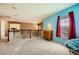 Open hallway boasts blue accent wall, window with red curtains, and view of the stairs and bedroom at 3624 Snowy Pines St, Las Vegas, NV 89147