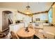 Bright eat-in kitchen featuring white cabinets, granite countertops, and modern appliances at 3624 Snowy Pines St, Las Vegas, NV 89147