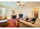 Inviting living room featuring a fireplace, plush seating, and a cozy ambiance at 3624 Snowy Pines St, Las Vegas, NV 89147